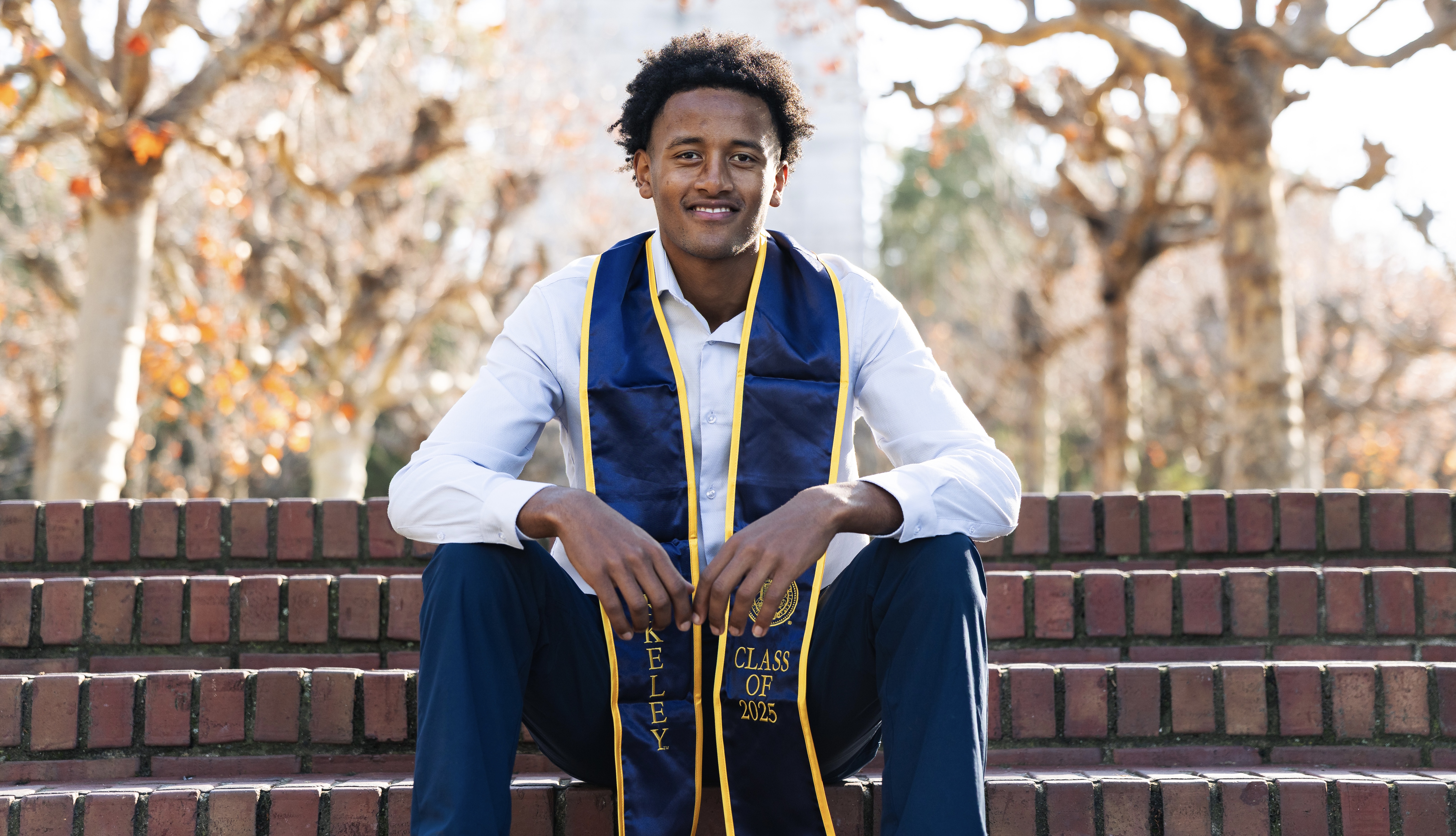 Belay Brummel in a Berkeley Class of 2025 graduation stole