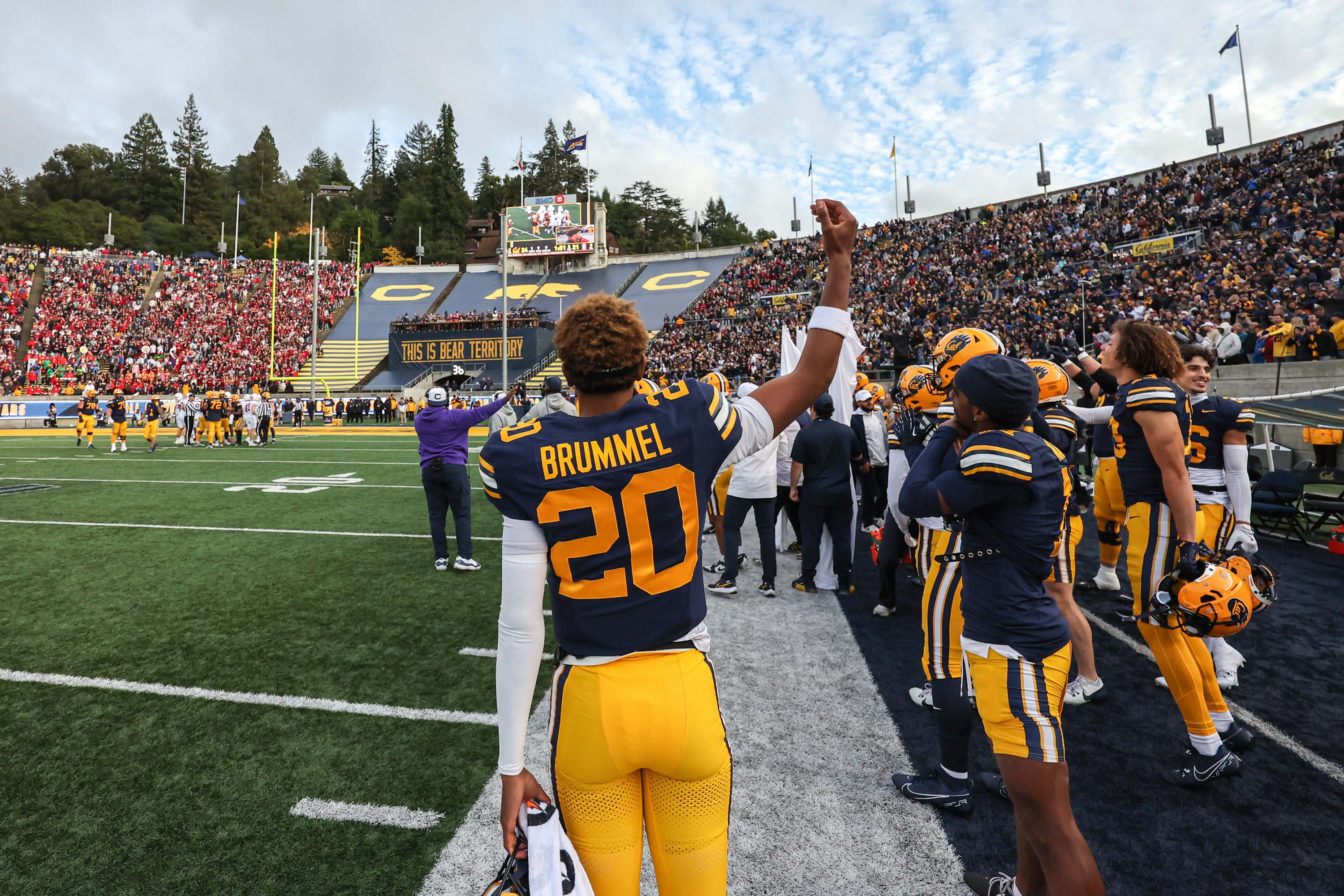 Belay Brummel, number 20, raising his fist on the Cal sideline at Memorial Stadium